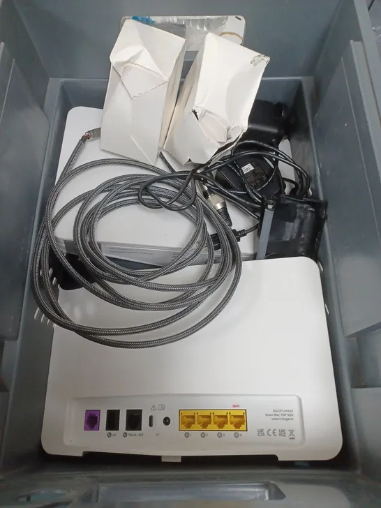 BOX OF APPROXIMATELY 10 ASSORTED ELECTRICXAL ITEMS TO INCLUDE ROUTERS , CABLES AND PLUGS