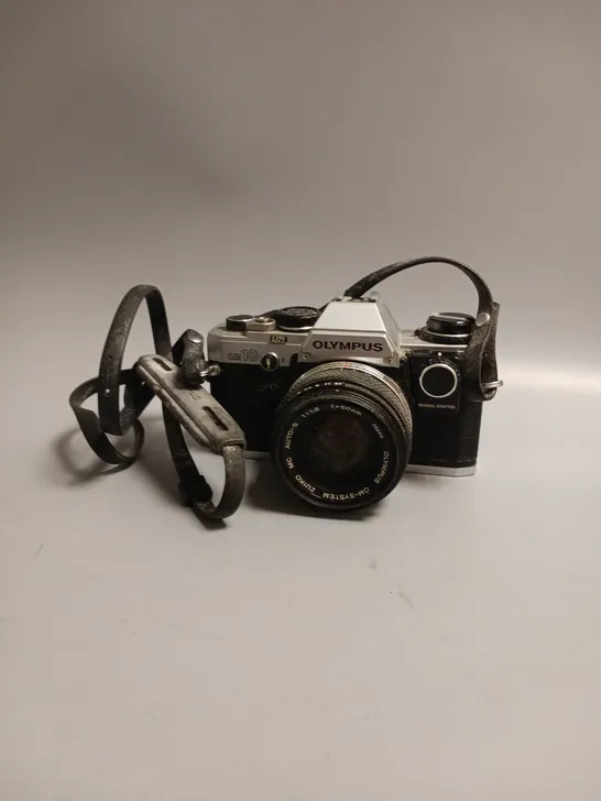 OLYMPUS FILM CAMERA OM 10 LEATHER STRAP INCLUDES MANUAL ADAPTOR