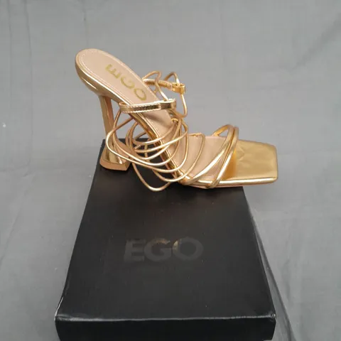 BOXED PAIR OF EGO GOLD HEEL RING TOP SIZE UK 5