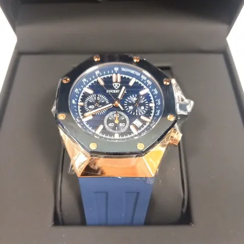 MEN’S RUCKSTUHL CHRONOGRAPH R400 WATCH – GOLD COLOUR CASE – SILVER DIAL – 3ATM WATER RESISTANT – BLUE RUBBER STRAP 