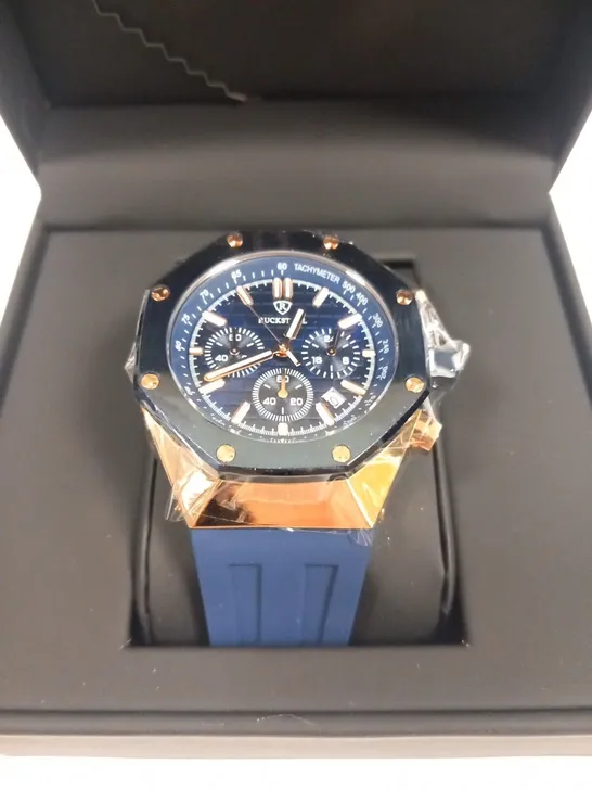 MEN’S RUCKSTUHL CHRONOGRAPH R400 WATCH – GOLD COLOUR CASE – SILVER DIAL – 3ATM WATER RESISTANT – BLUE RUBBER STRAP 