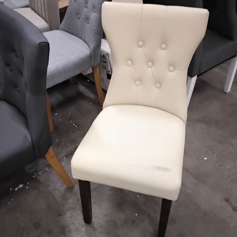 DESIGNER CREAM FAUX LEATHER DINING CHAIR WITH SHAPED BACK AND DARK BROWN LEGS 