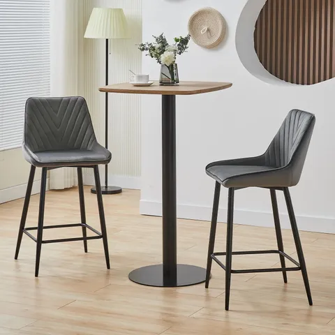 A BOXED PAIR OF GREY FAUX LEATHER UPHOLSTERED DINING CHAIRS