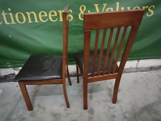 PAIR OF WOODEN DINING CHAIRS WITH BLACK FAUX LEATHER SEAT PADS 