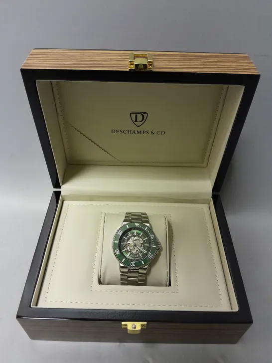 BOXED DESCHAMPS & CO AUTOMATIC GREEN SKELETON DIAL WATCH