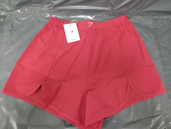 GYMSHARK SCALLOP HEM SHAPED SHORTS IN PINK - MEDIUM