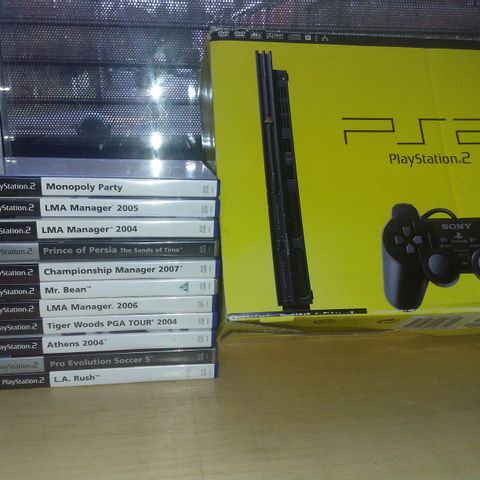 PLAYSTATION 2 CONSOLE WITH APPROXIMATELY 11 GAMES