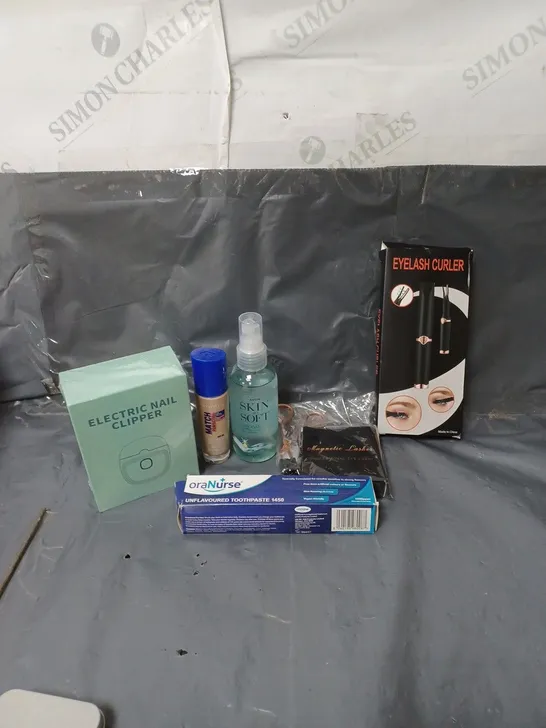 APPROXIMATELY 20 ASSORTED COSMETIC PRODUCTS TO INCLUDE EYE LASH CURLERS, RIMMEL FOUNDATION, AND ELECTRIC NAIL CLIPPERS ETC. 