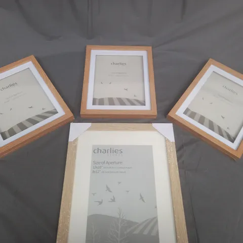 BOXED SET OF 4 CHARLIES STORES  PICTURE FRAMES IN VARIOUS SIZES 