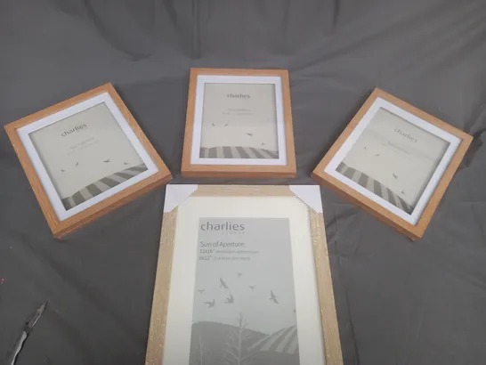 BOXED SET OF 4 CHARLIES STORES  PICTURE FRAMES IN VARIOUS SIZES 