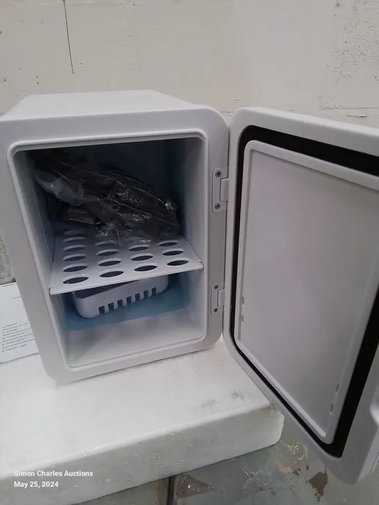 A BOXED MINI CAR REFRIGERATOR IN WHITE 