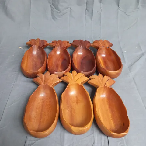 SET OF APPROX 7 WOODEN HAND CRAFTED PINEAPPLES