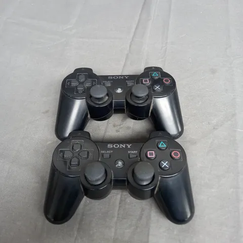 SET OF 2 PLAYSTATION 2 CONTROLLERS