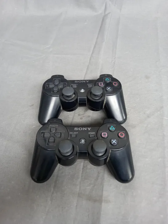 SET OF 2 PLAYSTATION 2 CONTROLLERS