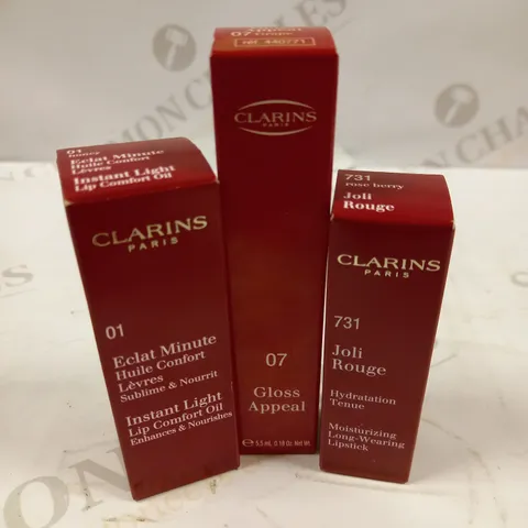 LOT OF APROX 30 ASSORTED CLARINS PARIS LIP CARE/MAKEUP PRODUCTS