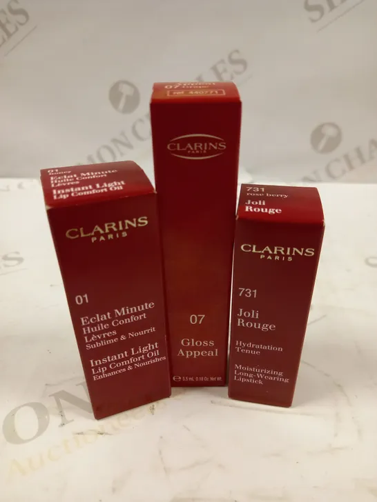 LOT OF APROX 30 ASSORTED CLARINS PARIS LIP CARE/MAKEUP PRODUCTS