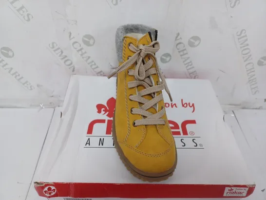 BOXED PAIR OF RIEKER LACE UP WATER RESISTANT BOOTS IN YELLOW SIZE 4