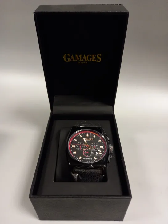 BOXED GAMAGES RETRO CALIBRE BLACK TRIPLE DATE DIAL AUTOMATIC TACHYMETER LEATHER STRAP WRISTWATCH	