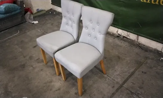 PAIR OF BEWLEY LIGHT GREY LEATHER BUTTON BACK DINING CHAIRS WITH OAK LEGS