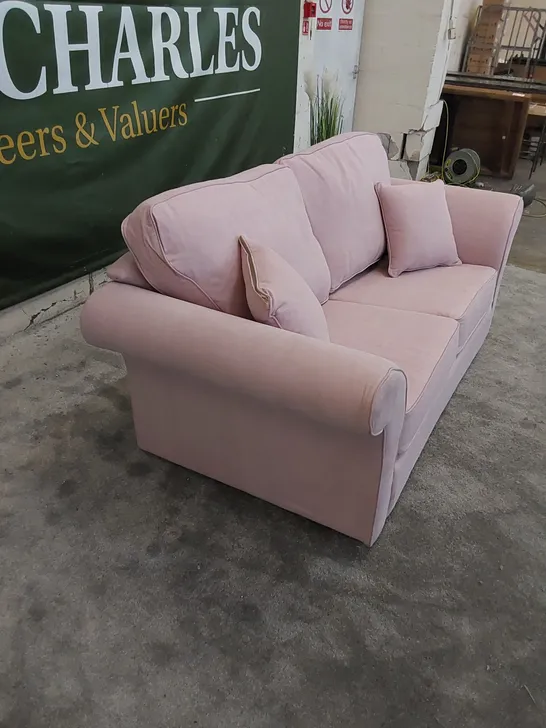 THE LANGRIDGE 2 SEATER SOFA BED IN UPHOLSTERED PINK FABRIC