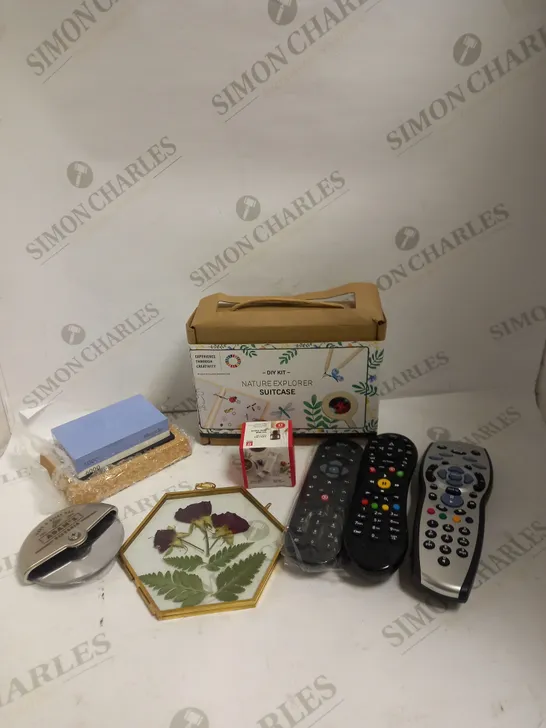 BOX OF APPROXIMATELY 15 ASSORTED HOUSEHOLD ITEMS TO INCLUDE NATURE EXPLORER SUITCASE, KNIFE SHARPENING BLOCK, VARIOUS SET TOP REMOTE CONTROLS ETC 