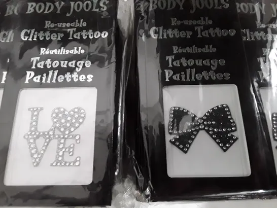 LOT OF APPROXIMATELY 200 PACKS OF BODY JOOLS LOVE AND BOW REUSABLE GLITTER TATTOOS 