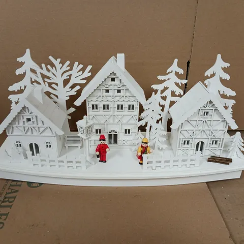 WHITE WOOD LIT VILLAGE SCENE