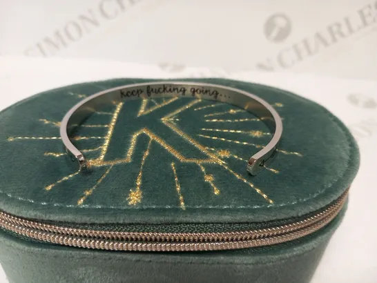 BRACELET INSCRIBED 'KEEP F***ING GOING'