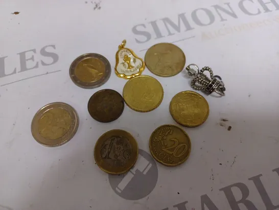 LOT OF ASSORTED COINS FROM VARIOUS CURRENCIES AND CHARMS