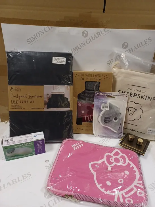 LOT OF APPROX 10 ASSORTED ITEMS TO INCLUDE A HELLO KITTY TABLET CASE, A NATURAL SHEEPSKIN MONGOLIAN CUSHION COVER, A SEASONAL HOT WATER BOTTLE ETC.  