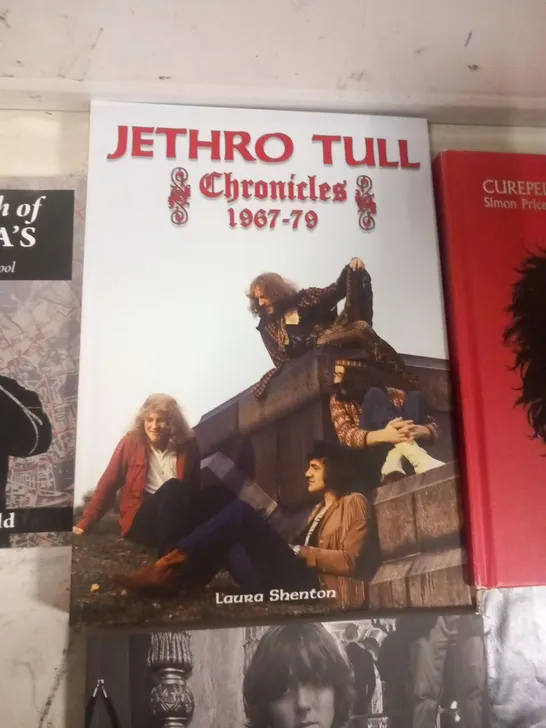 APPROXIMATELY SIX ASSORTED MUSIC BOOKS TO INCLUDE; BEATLES ANNIVERSARY MAGAZINE, JETHRO TULL CHRONICLES 1967-79, CUREPEDIA, BTS BEYOND THE STORY, I AM HATED FOR LOVING DICKIE FELTON AND IN SEARCH OF T