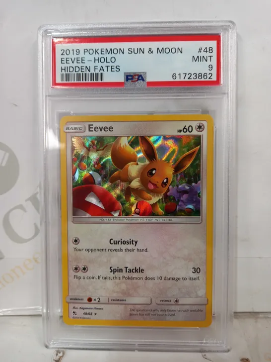 FRAMED AND GRADED COLLECTIBLE POKÉMON TRADING CARD - EEVEE HOLO (2019 S&M)