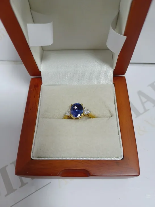 GOLD EFFECT RING WITH BLUE AND WHITE STONES