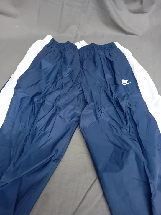 NIKE NAVY & WHITE TRACKSUIT PANTS - MEDIUM