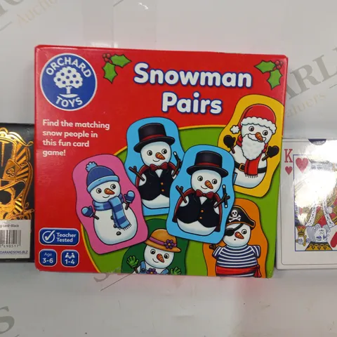 LOT OF APPROXIMATELY 10 ASSORTED TOYS AND GAMES TO INCLUDE PLAYING CARDS, SNOWMAN PAIRS, ETC