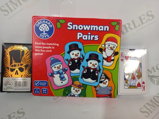 LOT OF APPROXIMATELY 10 ASSORTED TOYS AND GAMES TO INCLUDE PLAYING CARDS, SNOWMAN PAIRS, ETC