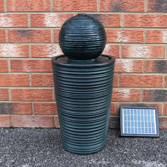 A BOXED DEBBAGH RESIN SOLAR POWERED WATER FEATURE 