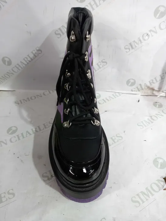 PAIR OF KOI VEGAN LEATHER ANKLE PLATFORM BOOTS IN BLACK WITH A PURPLE FLAME DESIGN - SIZE 9