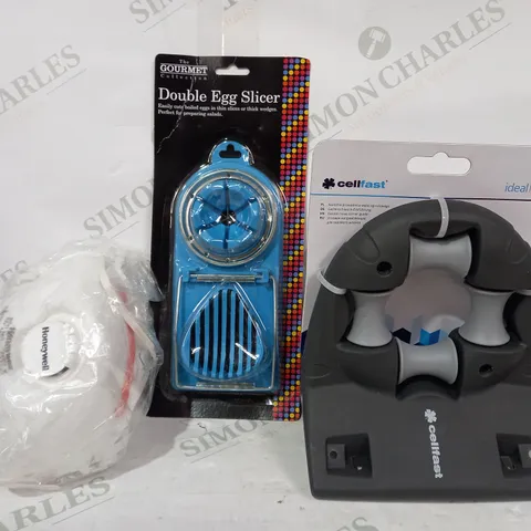 BOX OF APPROXIMATELY 20 ASSORTED HOUSEHOLD ITEMS TO INCLUDE IDEAL LINE GARDEN HOSE CORNER GUIDE, DOUBLE EGG SLICER, ETC