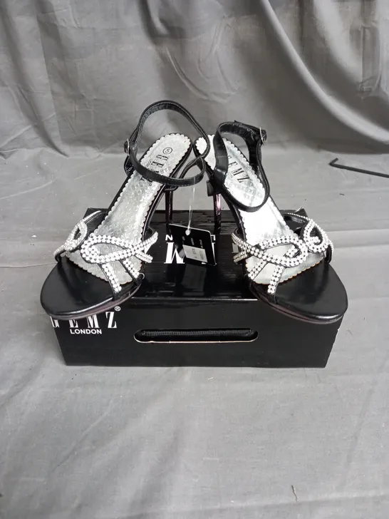 BOX OF APPROXIMATELY 12 PAIRS OF GEMS STRAP RHINESTONE HEELS IN BLACK - VARIOUS SIZES