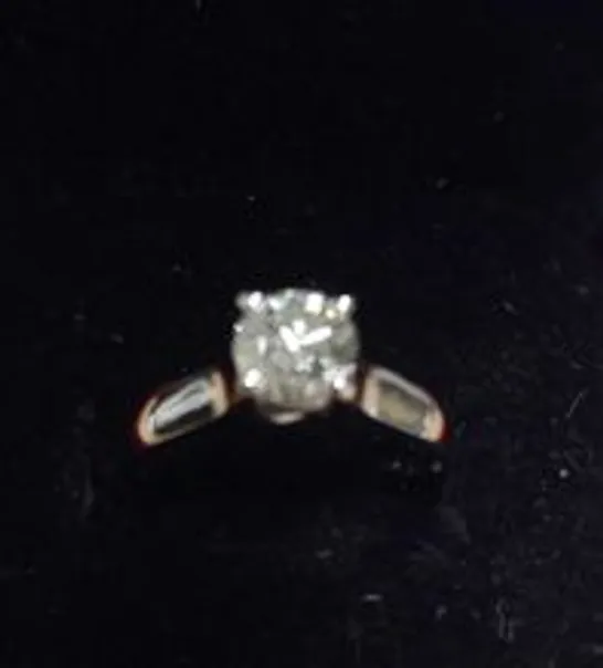 18CT WHITE GOLD SOLITAIRE RING SET WITH A NATURAL DIAMOND