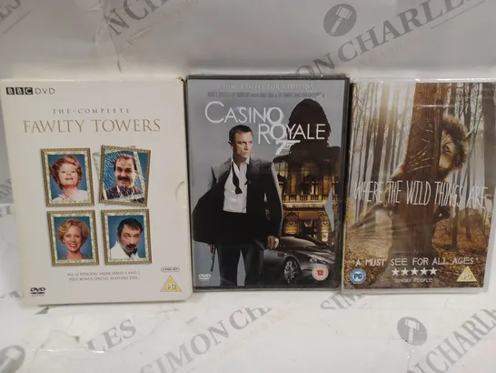 BOX OF APPROXIMATELY 15 ASSORTED DVDS TO INCLUDE THE COMPLETE FAULTY TOWERS, CASINO ROYALE, WHERE THE WILD THINGS ARE, ETC