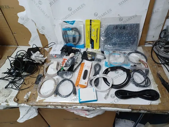 BOX OF APPROX 35 ASSORTED TECH ITEMS TO INCLUDE CABLES, PC REMOTE, THERMAL PASTE ETC