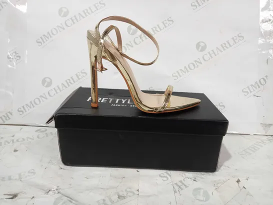 BOXED PAIR OF PRETTY LITTLE THING POINTED OPEN TOE HIGH HEELED SANDALS IN METALLIC GOLD UK SIZE 3