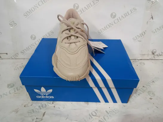 BOXED PAIR OF ADIDAS OZWEEGO SHOES IN BEIGE UK SIZE 7