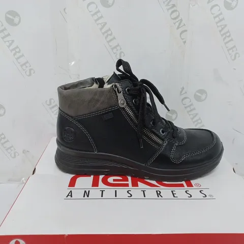 BOXED PAIR OF RIEKER WATER RESISTANT BOOTS IN BLACK SIZE 5