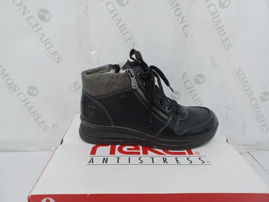 BOXED PAIR OF RIEKER WATER RESISTANT BOOTS IN BLACK SIZE 5