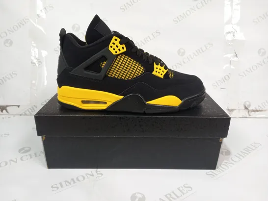 BOXED PAIR OF NIKE AIR JORDAN 4 RETRO SHOES IN BLACK/YELLOW UK SIZE 8