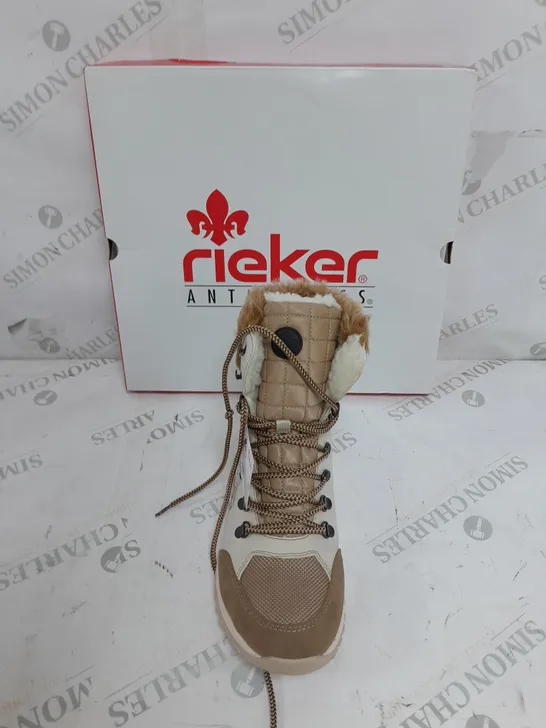 BOXED PAIR OF RIEKER CREAM WINTER FUR HIKE BOOTS IN SIZE 6