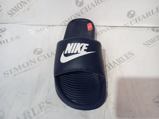 PAIR OF NIKE SLIDERS IN NAVY UK SIZE 7